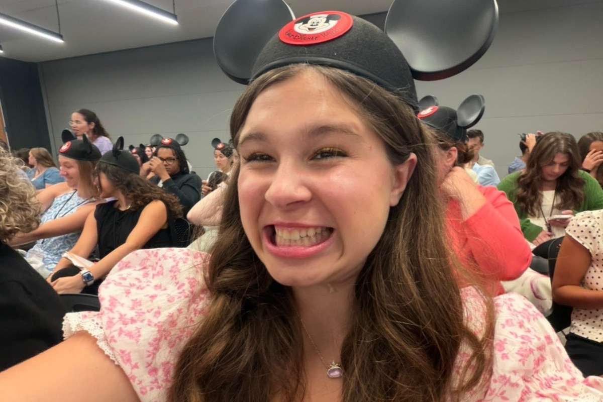 Farrar wearing Mickey Mouse ears takes a selfie during an orientation session for the Disney College Program.
