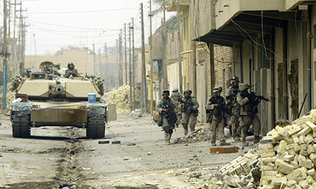 Army tank and patrol on Iraqi street