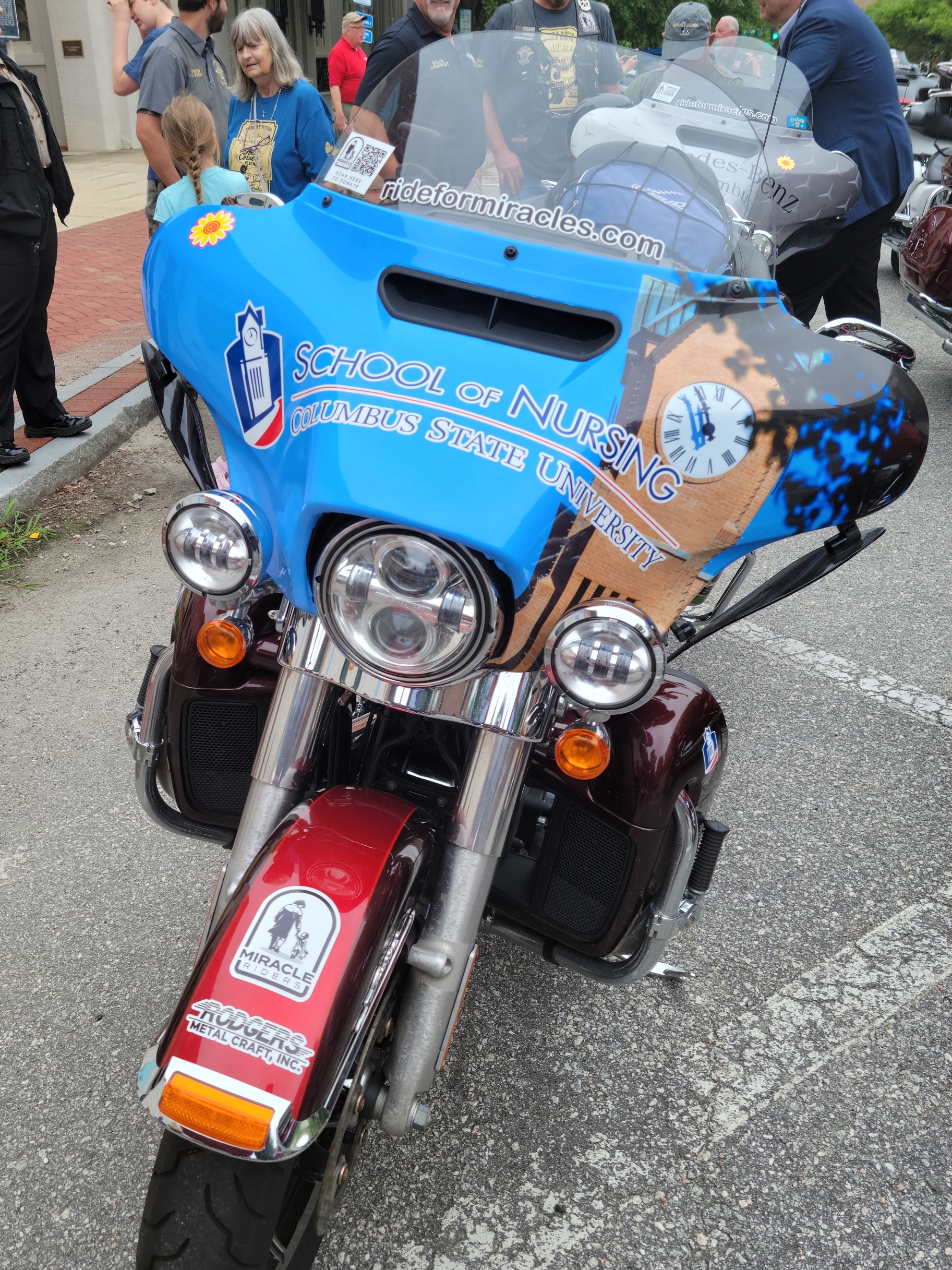Light blue motorcycle bearing the Columbus State University School of Nursing logo