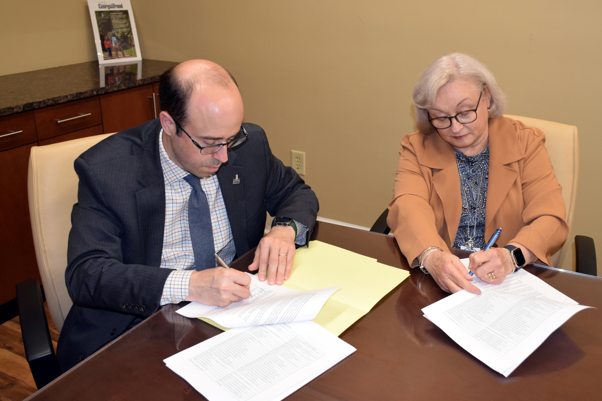 Fuchko and Todd sign the academic pathways articulation agreement