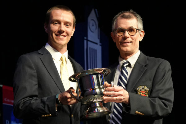 Spencer White (left) receiving Faculty Cup from Provost Pat McHenry (right)