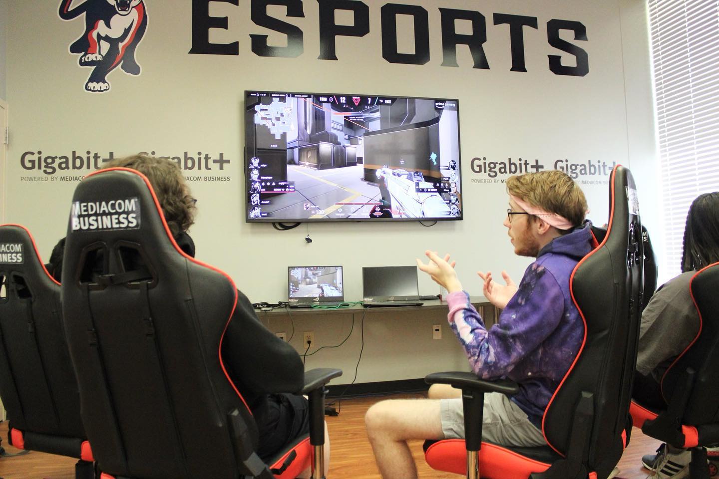 Students in the Davidson Student Center's Mediacom Business gaming room