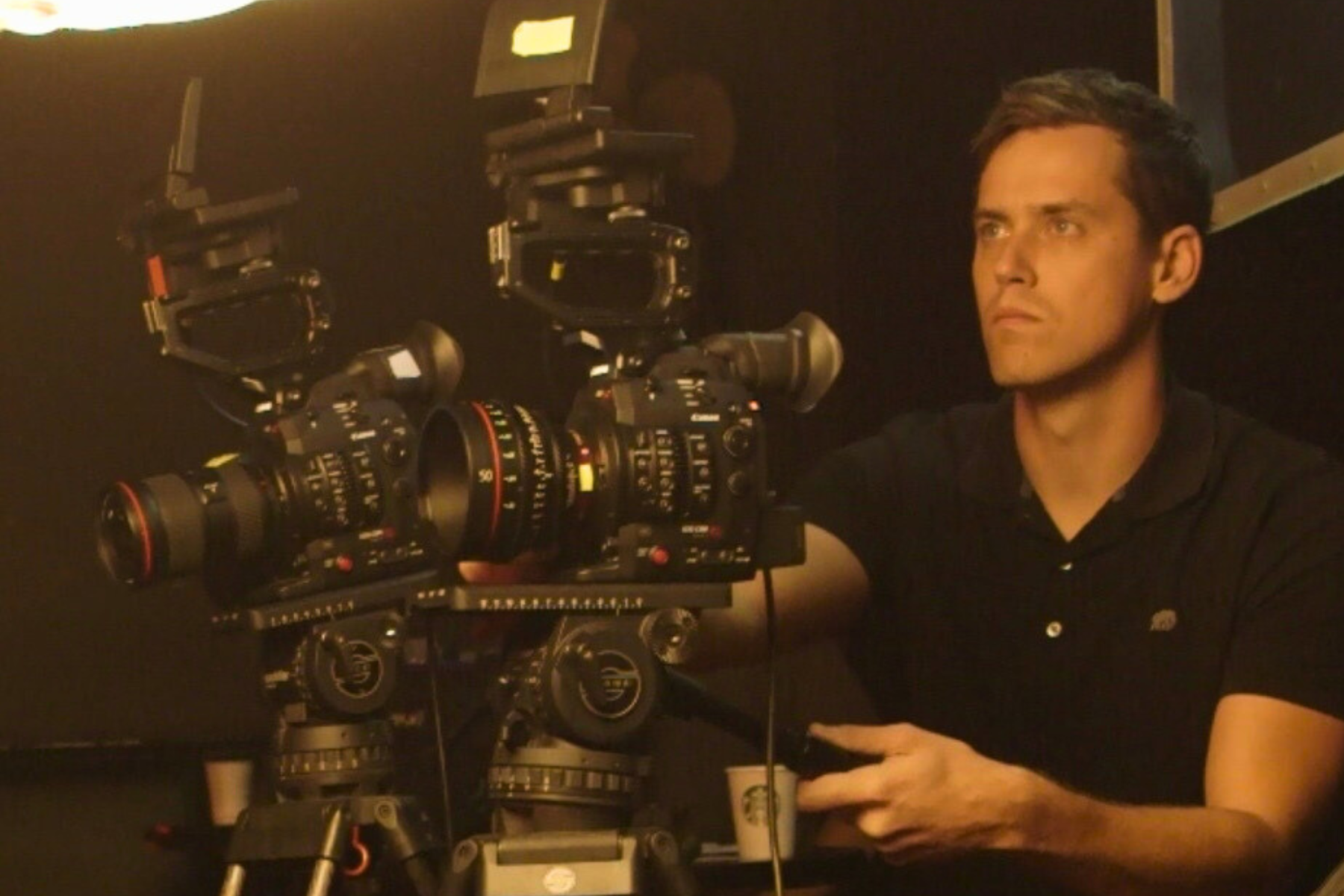 Jonathan Vogler working behind camera and film equipment