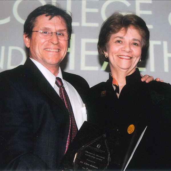 Tom Hackett presenting an award to Ellen Roberts