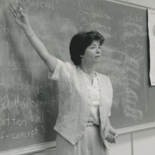 Black-and-white image of Ellen Roberts teaching