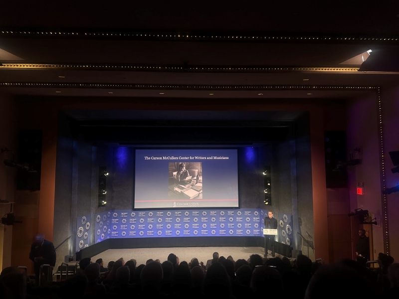 Photo of Nick Norwood speaking at the "Wunderkind" premiere about the Carson McCullers Center.