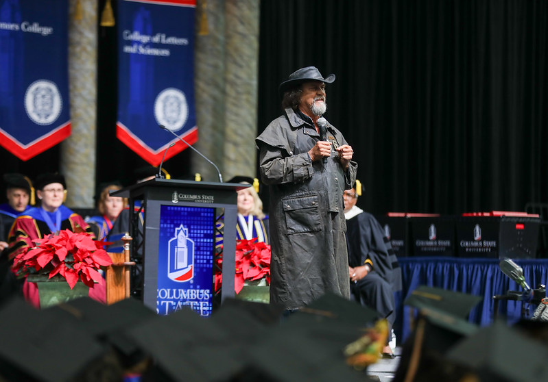 Ressmeyer addresses graduates from the commencement ceremony stage