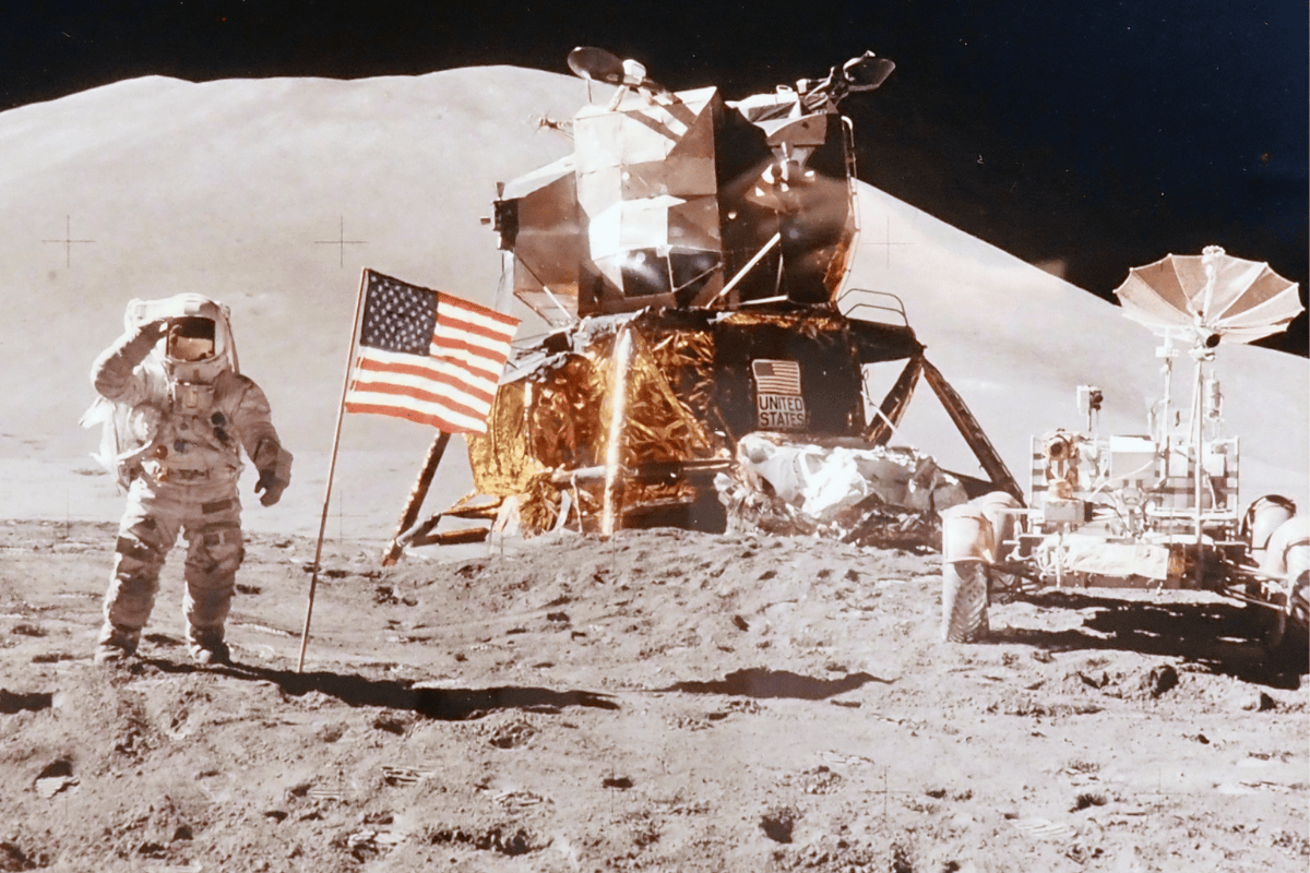 Astronaut David Scott saluting the American flag during an Apollo 15 moonwalk