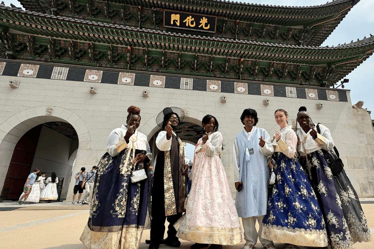 Columbus State students exploring South Korean landmarks and dressed in local garb as part of a study abroad trip