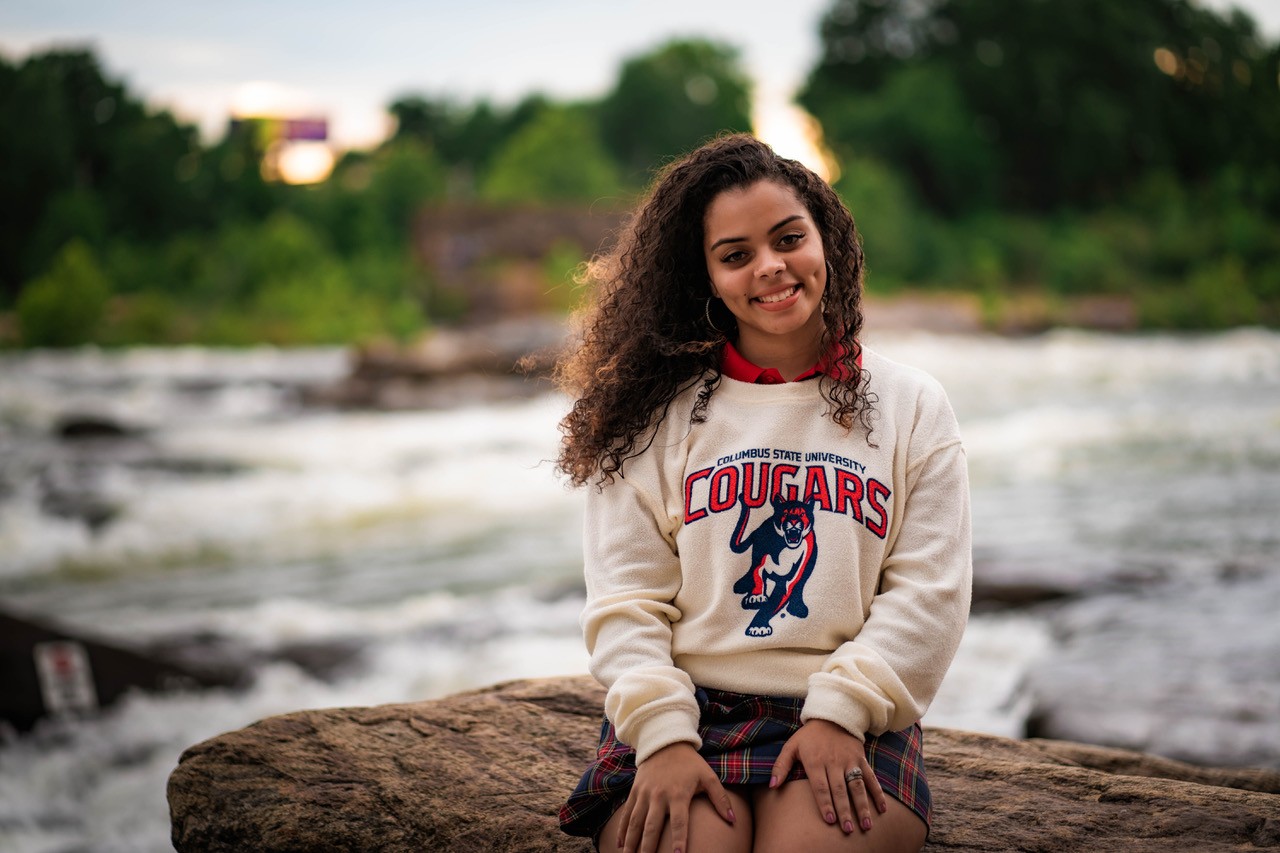 Photo of Tatianna Blake on the banks of the Chattahoochee River