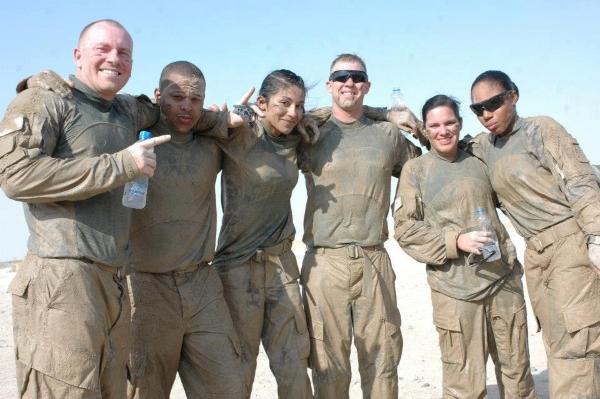 Amanda Zarate standing wtih fellow active-duty Army soliders
