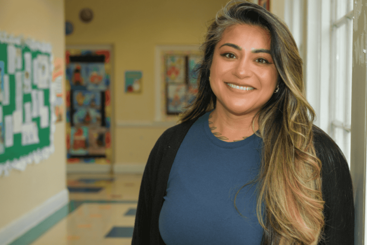 Amanda Zarate standing in a school hallway