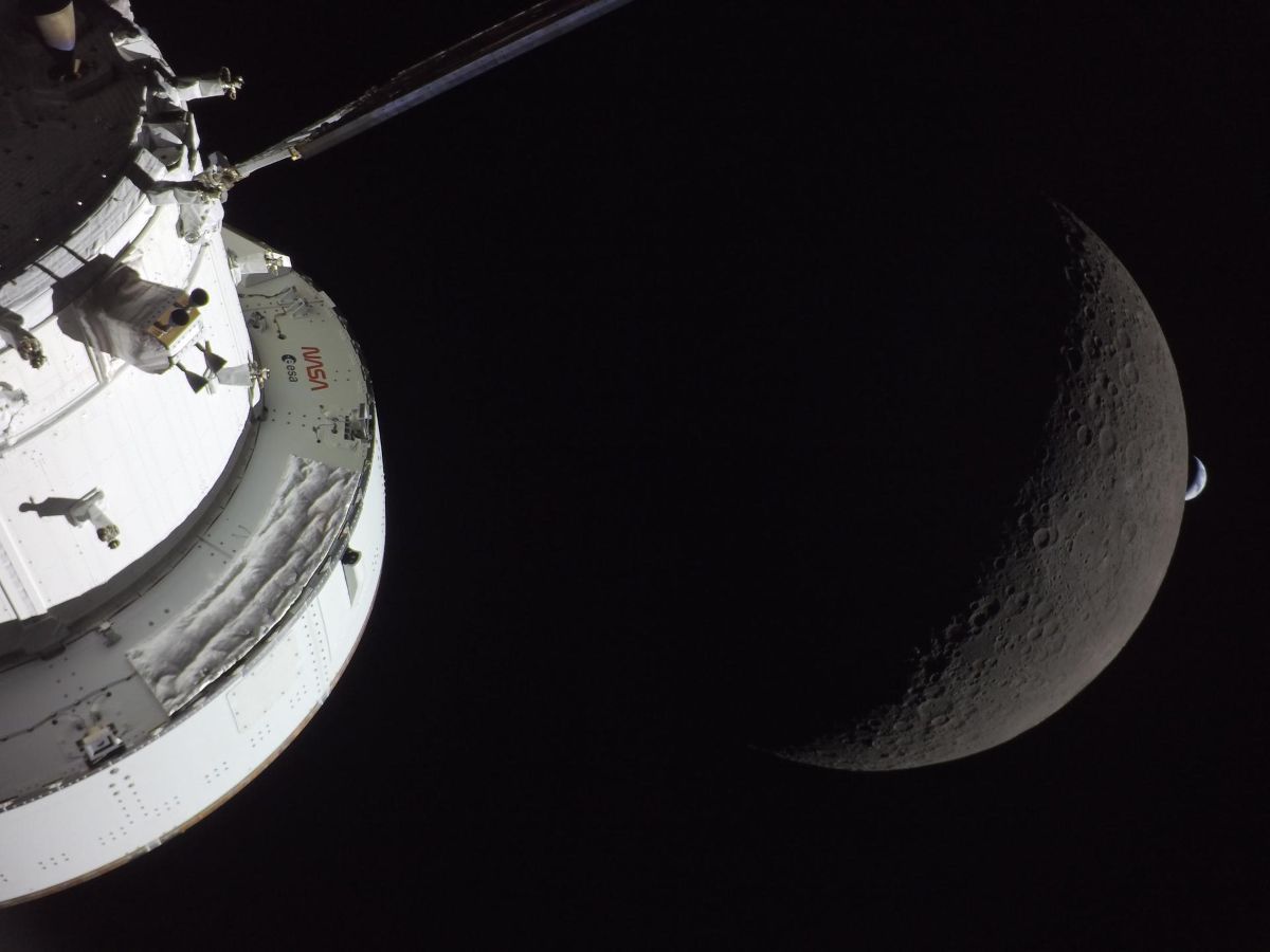 NASA’s Orion spacecraft captures the Moon and the Earth in one frame during the Artemis II crew’s deep space journey at 6:42 p.m. ET on the sixth day of the mission. The right side of NASA’s Orion spacecraft is seen lit up by the Sun. A waxing crescent Moon is visible behind it. And then, a crescent Earth, tiny compared to the Moon, is about to set below the Moon’s horizon on the right. Credit: NASA
