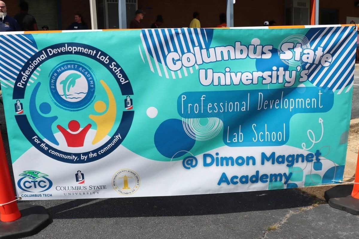 Here is the WCAG 2.1 Level AA compliant alt text for the image image_7a5793.jpg, ensuring all the critical text and logos embedded in the graphic are fully transcribed for screen readers:  A teal and white outdoor banner that reads 