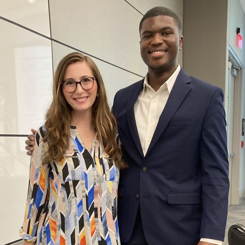 Belle poses alongside Hardin following a corporate internship presentation.