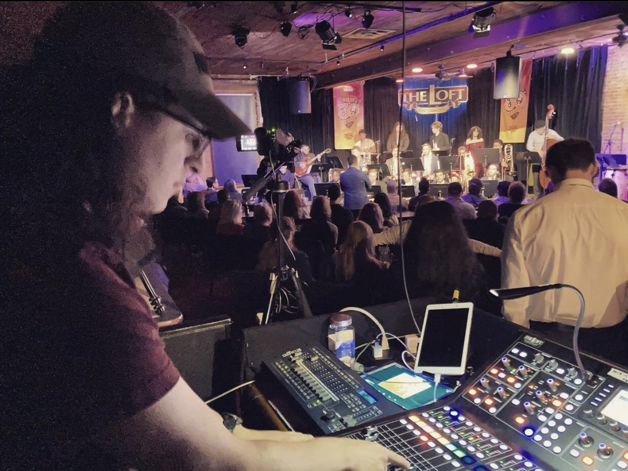 CSU student operating a sound board at The Loft