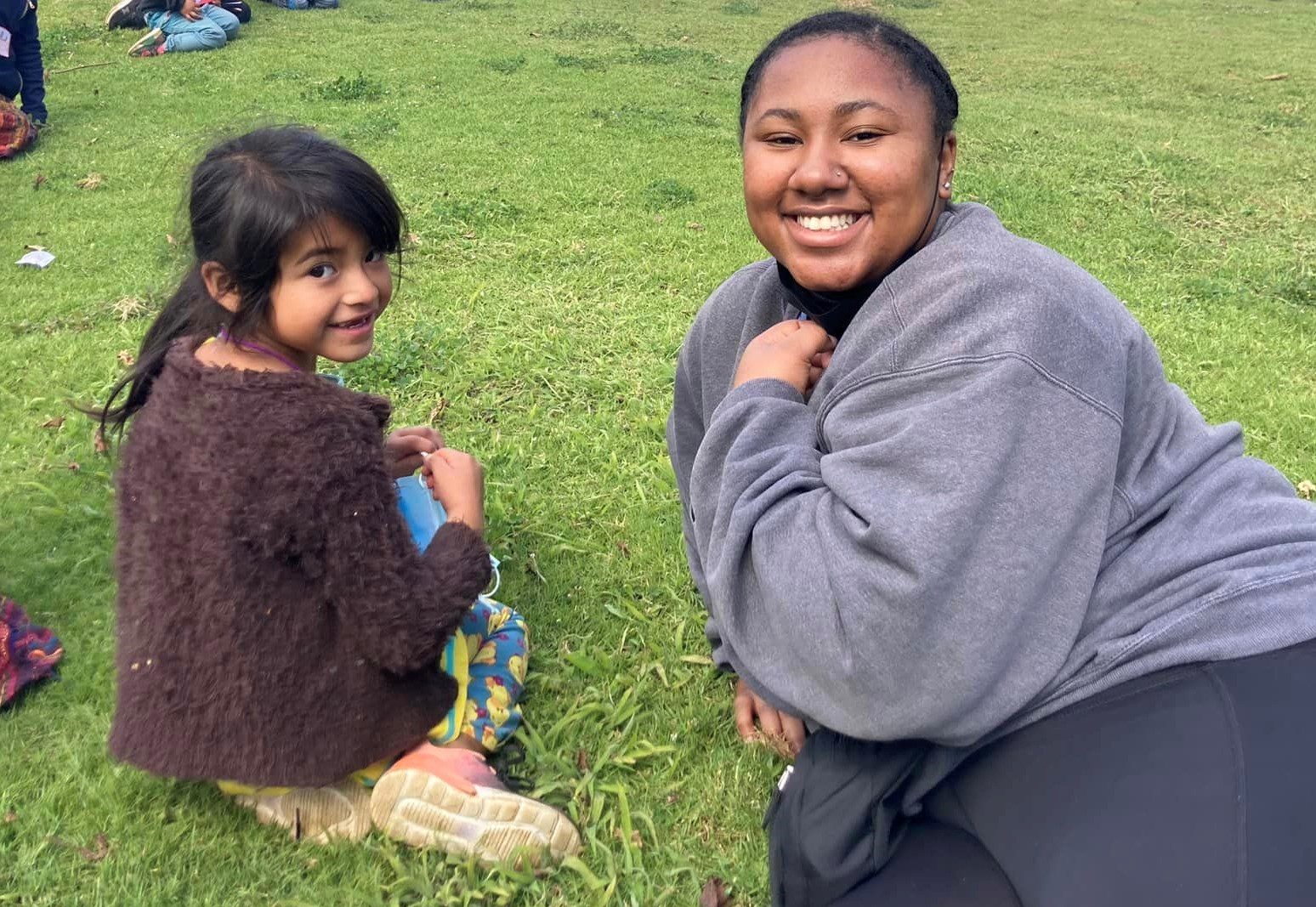 Mackenzie Skeene with villager children in Quatemala