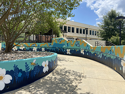 a painted mural of flowers and butterflies