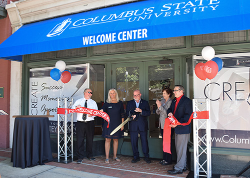 From left: CEO of Uptown Columbus Ed Wolverton, VP for Enrollment Management Sallie McMullin, CSU President Chris Markwood, CSU Provost Deborah Bordelon and Director of Admissions Gary Bush cut the ribbon on the RiverPark Welcome Center.
